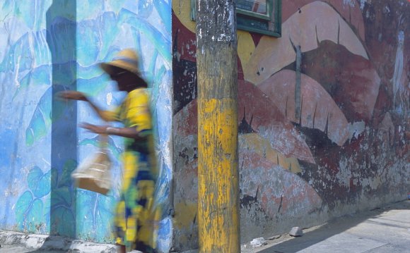 Woman walking in Anse La Raye