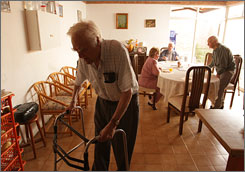 Bert Bouchard, 79, walks to his space after dinner with Irene Chiara, George Adams, 84, and Fred Roswold, 87, at El Paraiso Convalescent Residence in Ajijic, Mexico. Bouchard relocated to Mexico from Nashua, N.H., 14 years ago.